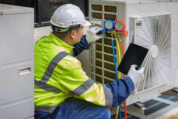 Professional Air Conditioning Repair technician working in Peculiar, MO